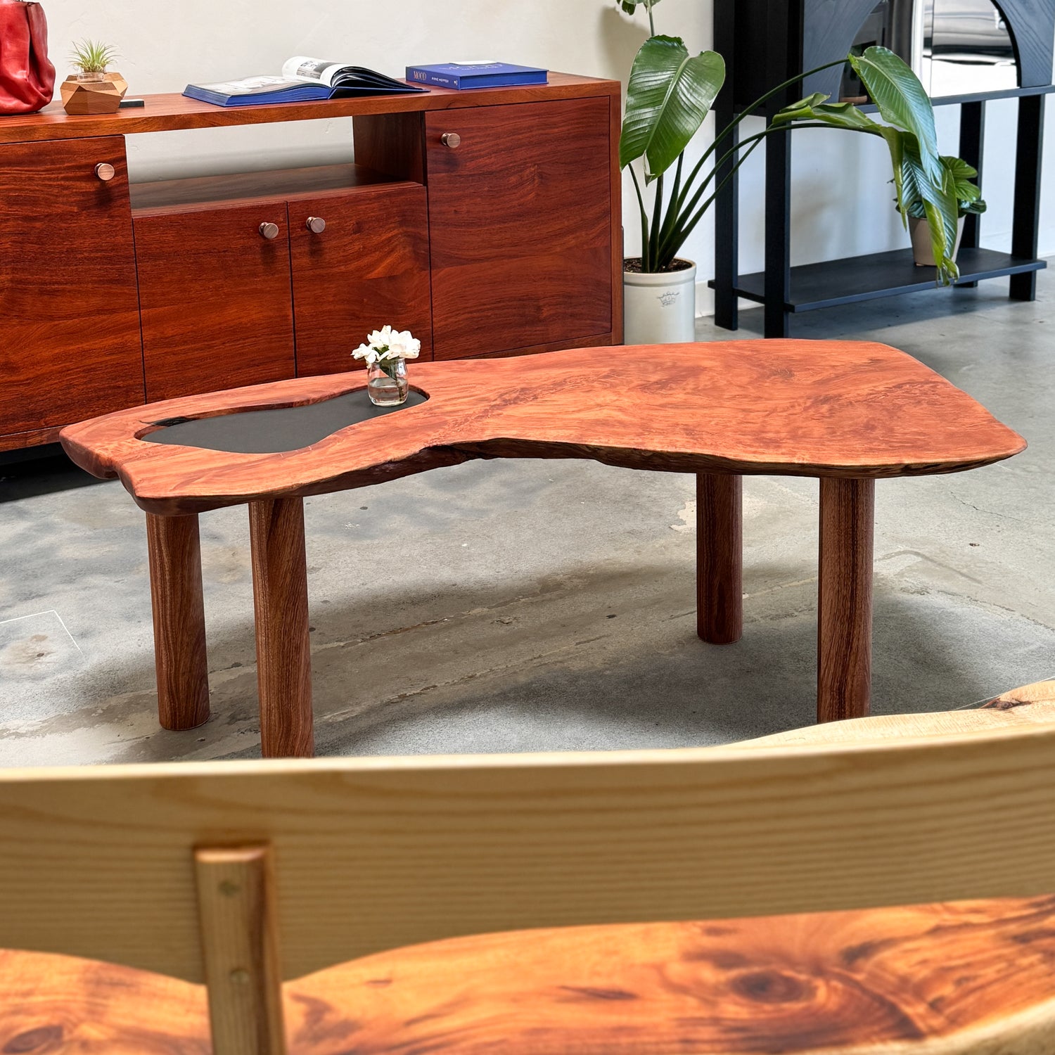 Wooden coffee table made of Lychee and Mahogany hardwoods with a natural finish in a chic industrial room setting