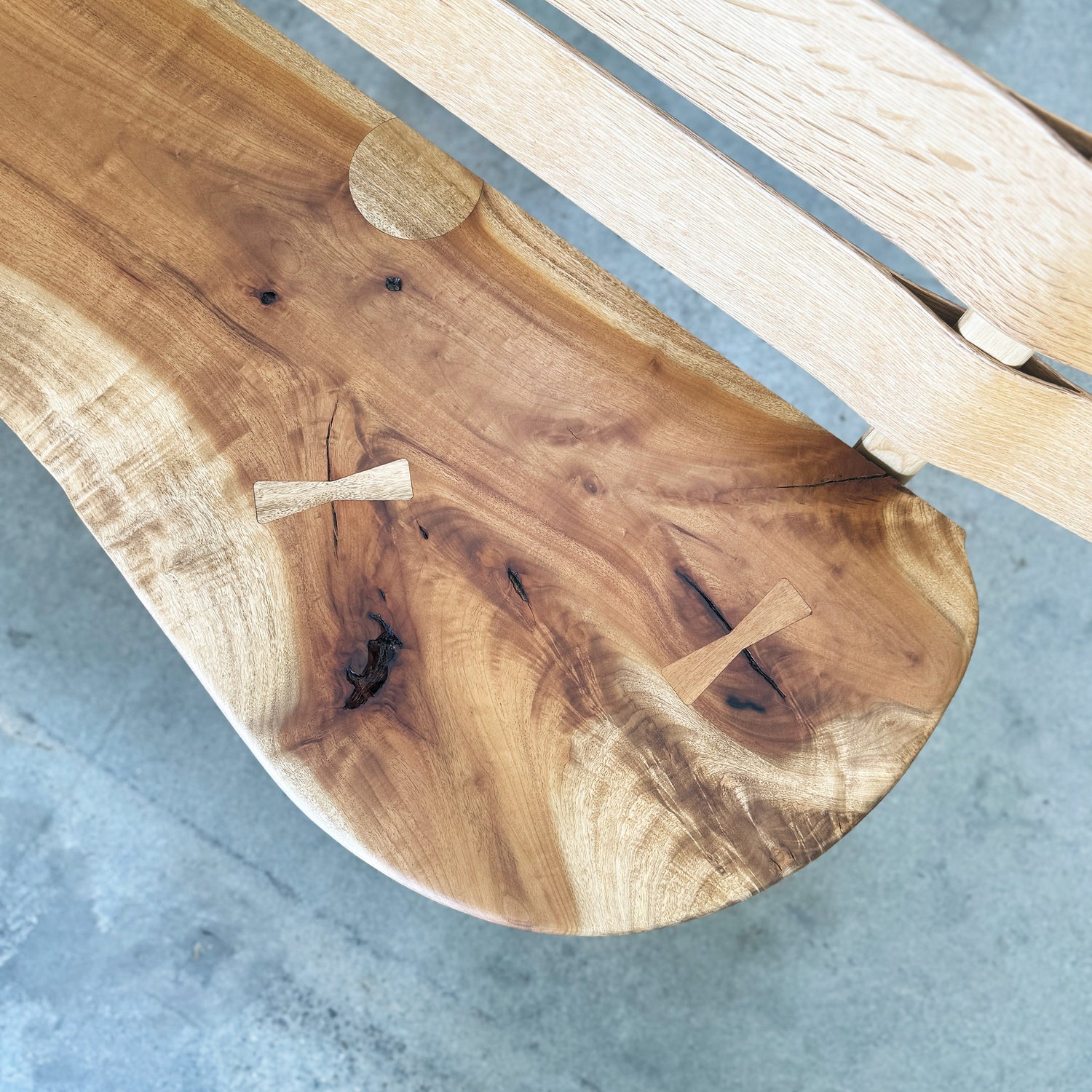 Close-up of a wooden surface with a natural grain pattern on a gray background