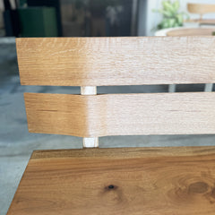 Close-up of a wooden chair with a blurred background